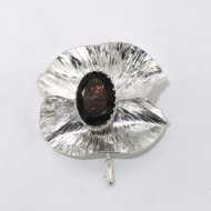 SIlver form fold brooch with topaz